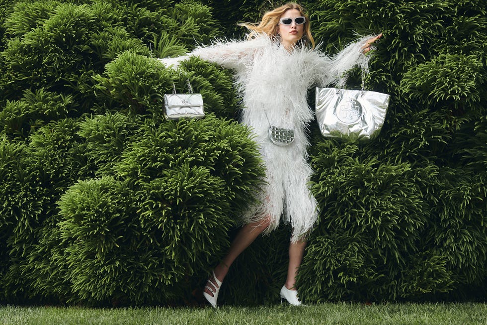 person showcasing fashion amidst lush greenery