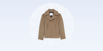 stylish tan jacket with a modern design against a subtle patterned background