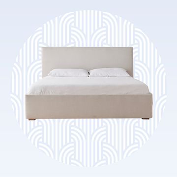 a bed with a white cover