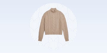 beige knitted sweater with a turtleneck and textured patterns