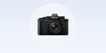 nikon z f camera with a prominent lens against a subtle background