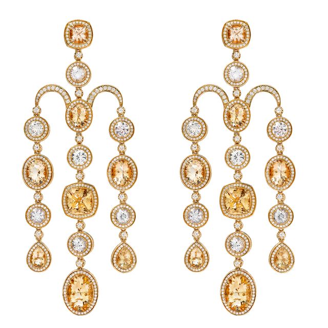 a pair of gold earrings