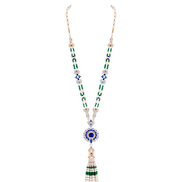 a necklace with a blue stone pendant