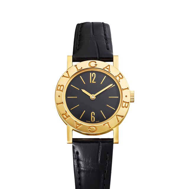 a gold and black wrist watch