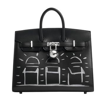 a black handbag with a white background
