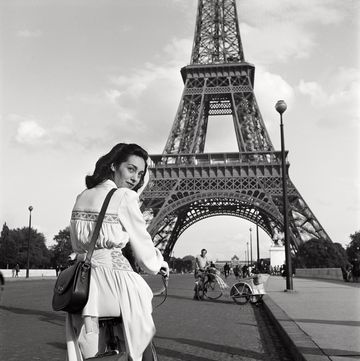 parisian woman in front of the eiffel tower 1945