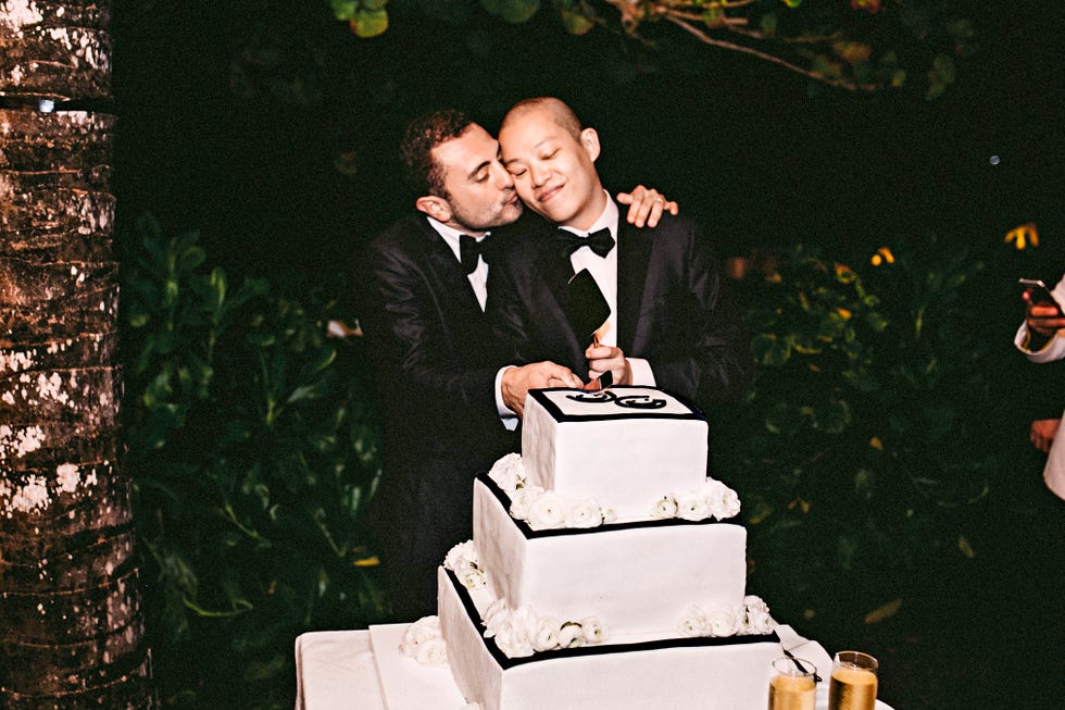 Wedding cake taking a tumble with laughing guests