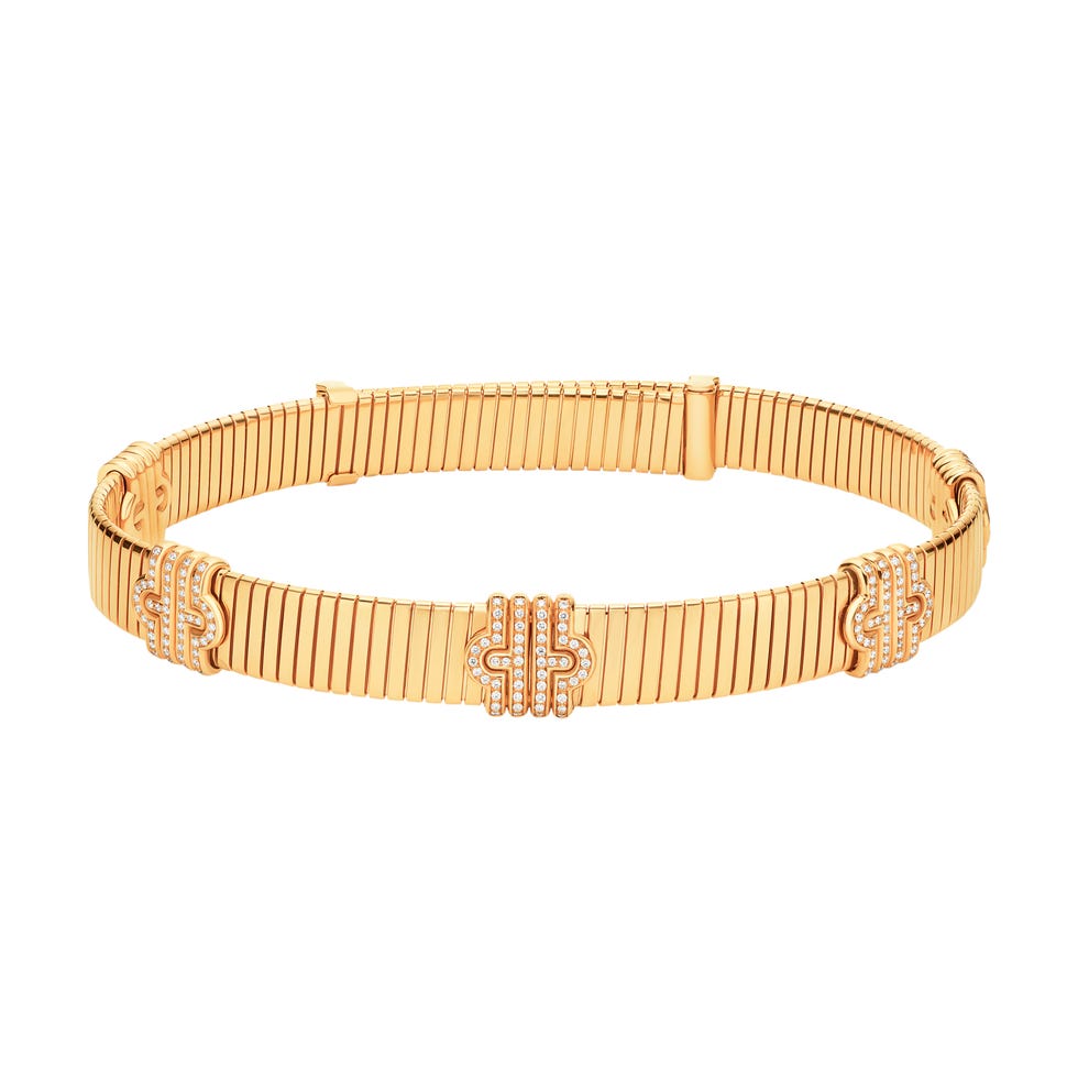 a wooden bracelet with a gold band