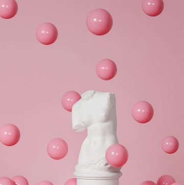 plaster model of female torso mass produced replica of venus de milo and pink spheres