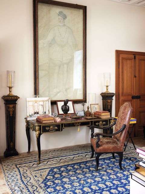 in the petit salon, a victor koulbak portrait hangs above a regency desk