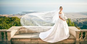 Wedding dress, Bride, Photograph, Dress, Gown, Bridal veil, Bridal clothing, Veil, Bridal accessory, Sky, 