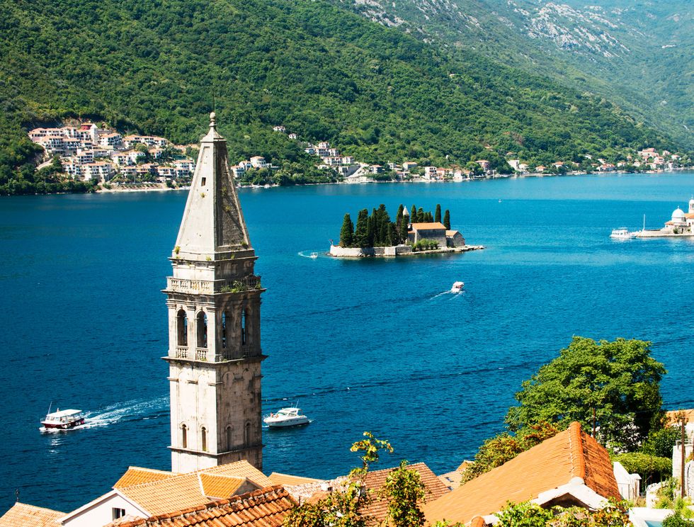 kotor bay in montenegro, the village of perast and the bell tower of the church of saint nicholas the two islands are saint george and our lady of the rocks with the roman catholic church of the same name
