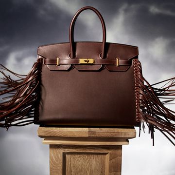 a brown purse on a pedestal