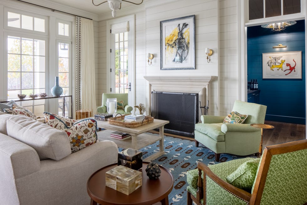 living room with fireplace and armchairs