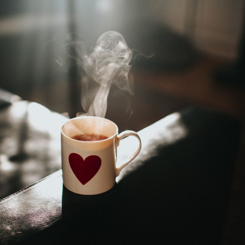 hot cup of strong tea in a mug with a heart