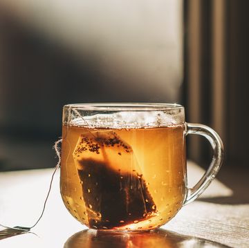 tea bag put in transparent glass teacup