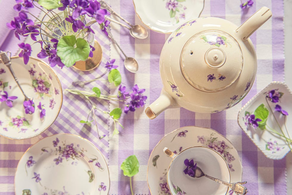 tea cups, plates and violets