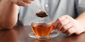 teabag in the cup with hot water