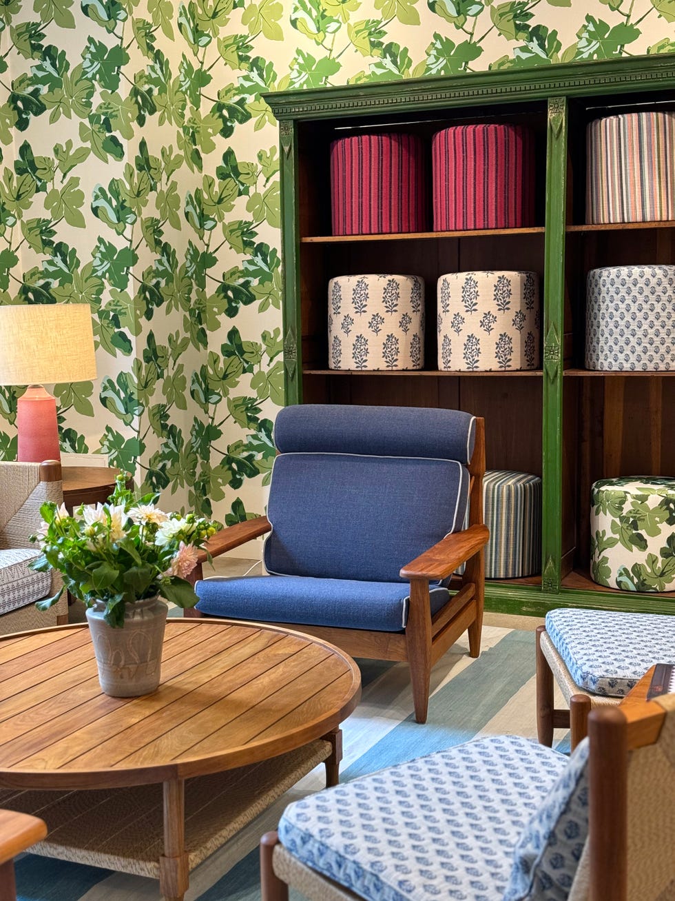 Peter Dunham's textile collection is showcased through chair cushions, pouf upholstery and wall coverings, with many bright, competing prints.