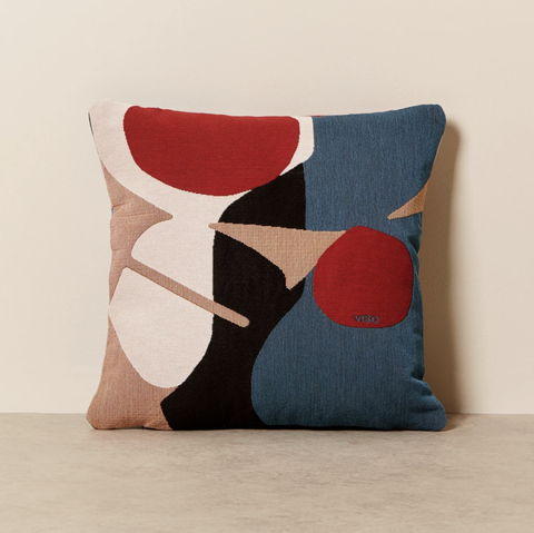 red, teal, black, and pink pillow abstract design