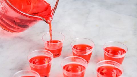 red jello shots being poured