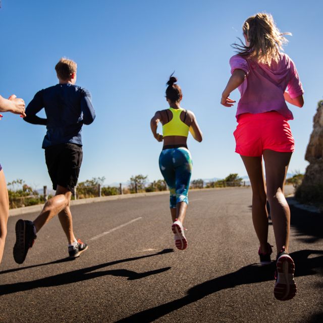 team of athletes running outdoors on summer