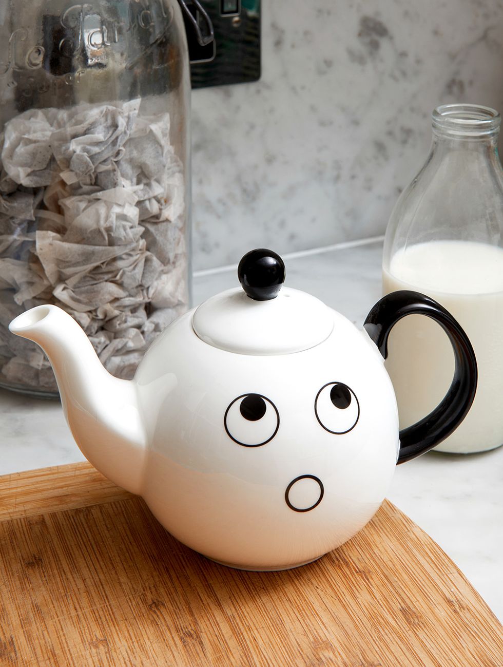 a teapot with a face on it
