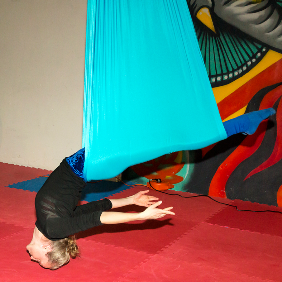 woman in aerial yoga hammock