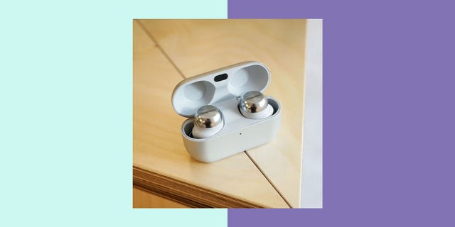 technics eah az100 wireless earbuds in a charging case on a wooden surface