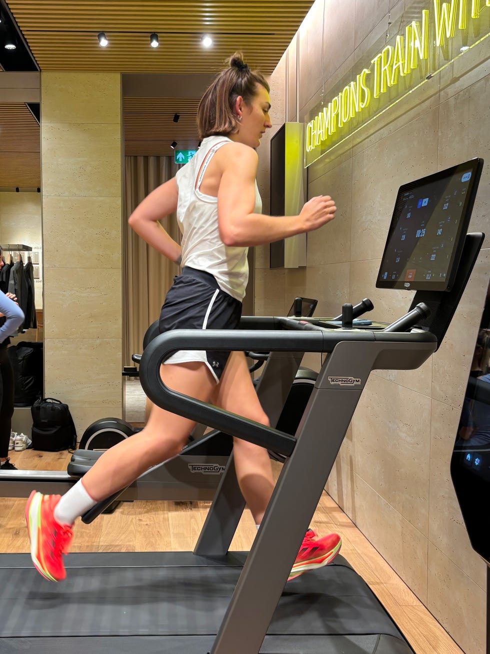 woman running on the technogym run treadmill