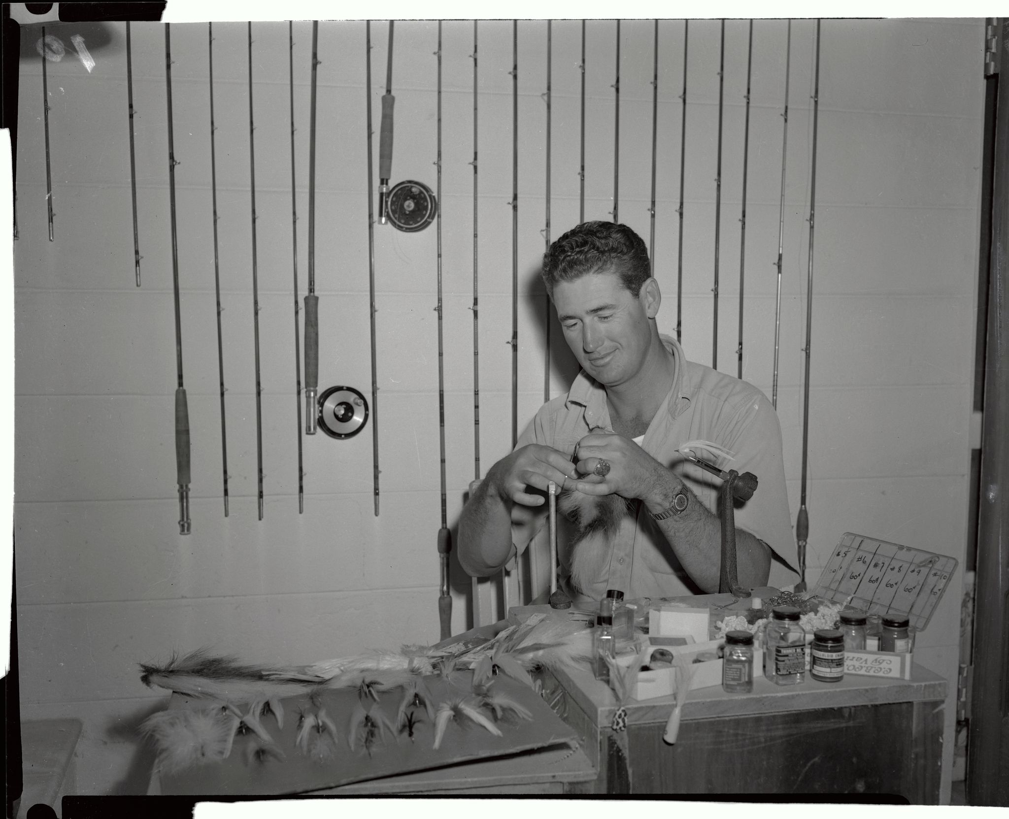 ted williams preparing flys for fishing