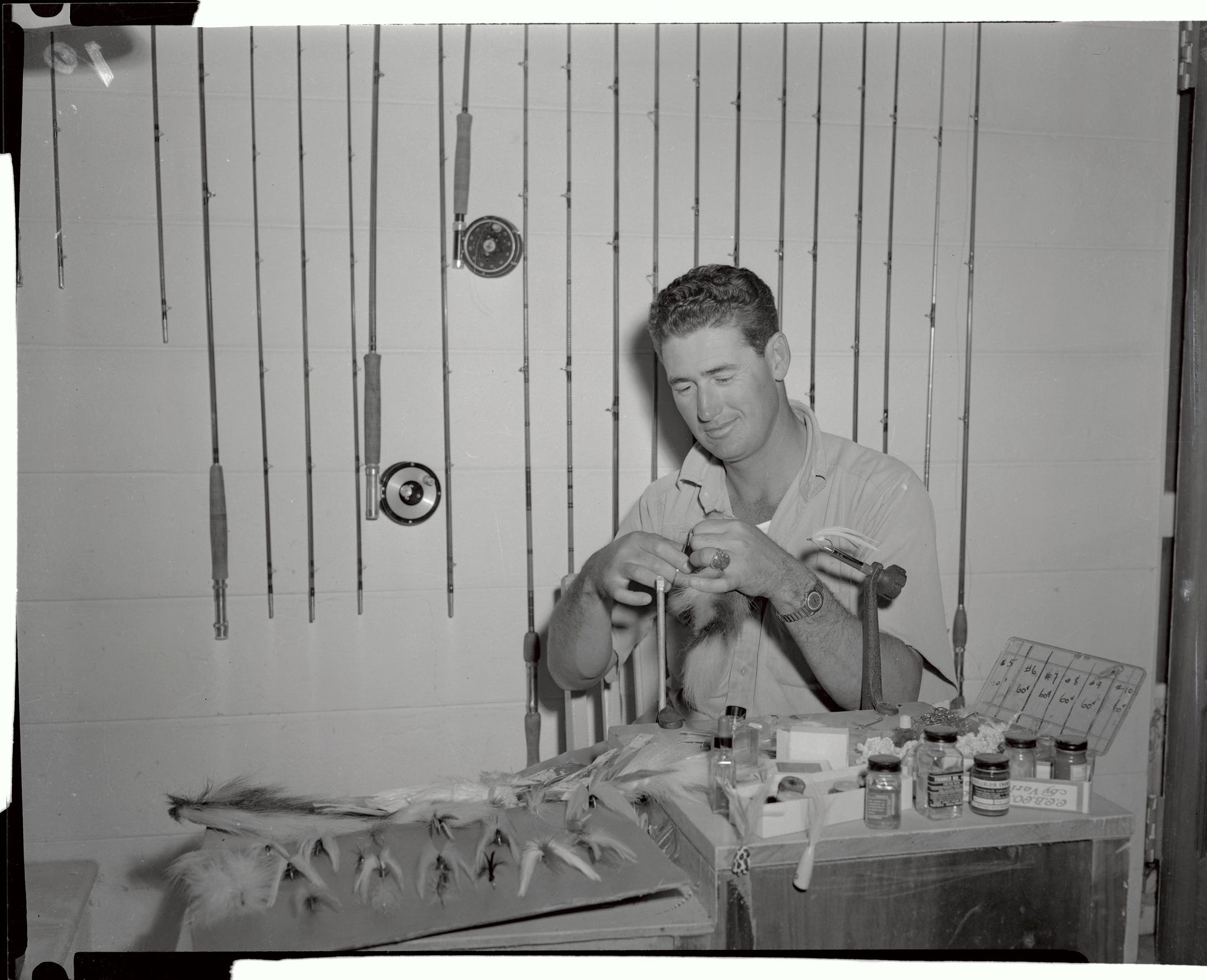 ted williams preparing flys for fishing