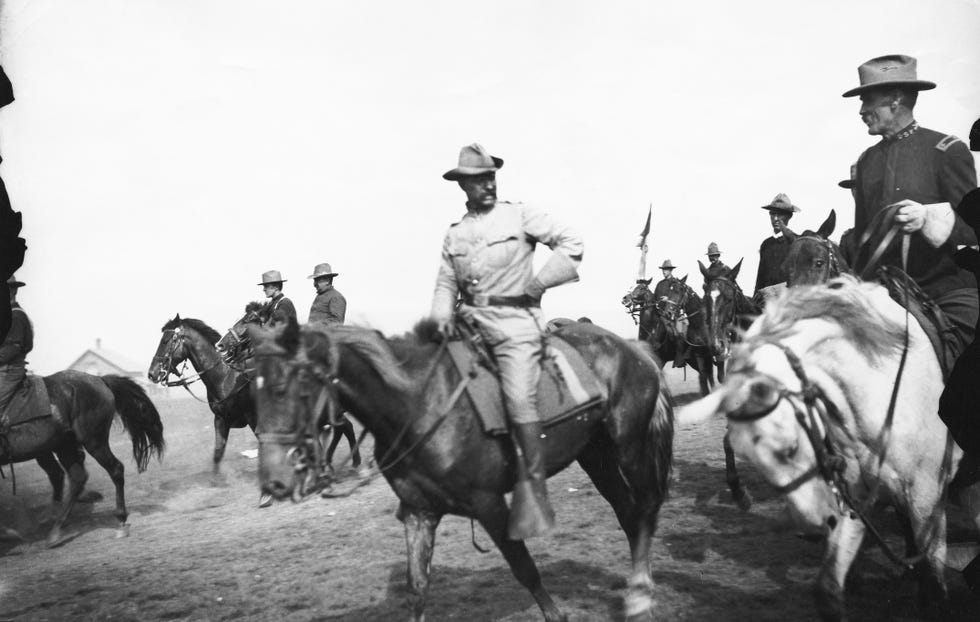 teddy roosevelt on horseback with hand on hip