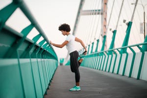 teen girl exercising on bridge