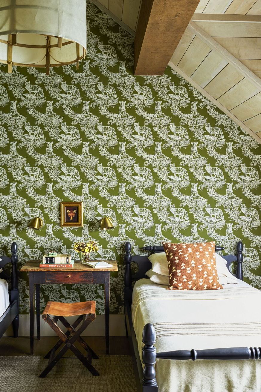 green wallpaper in twin bedroom