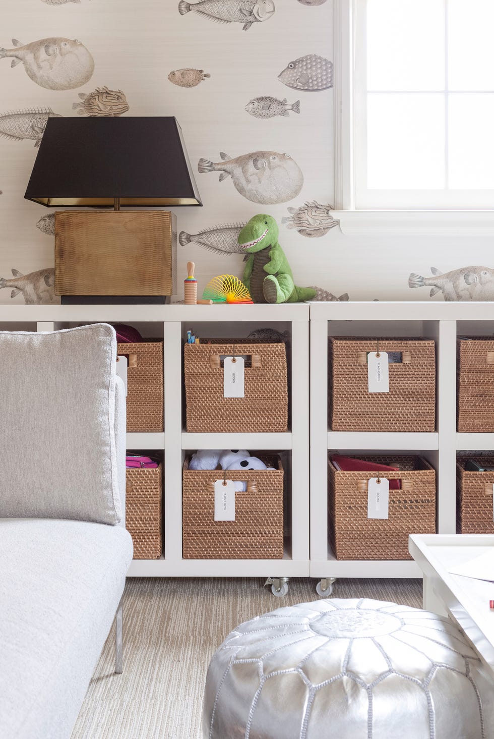 kids room with organizer bins and metallic pouf