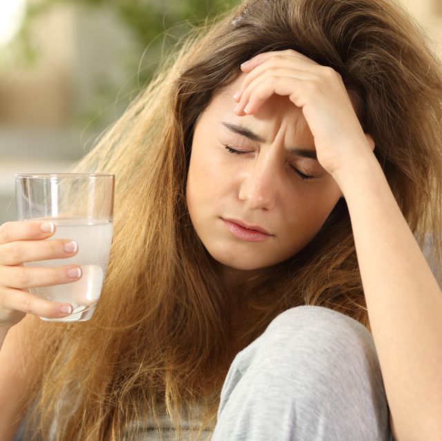 teen suffering head ache at home