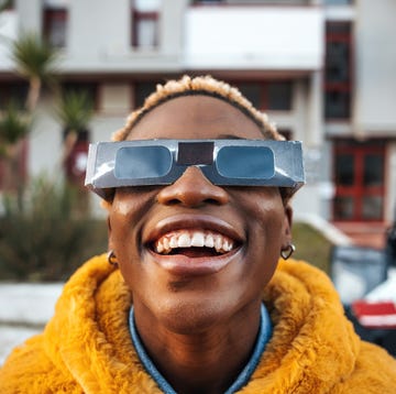 girl looking at solar eclipse