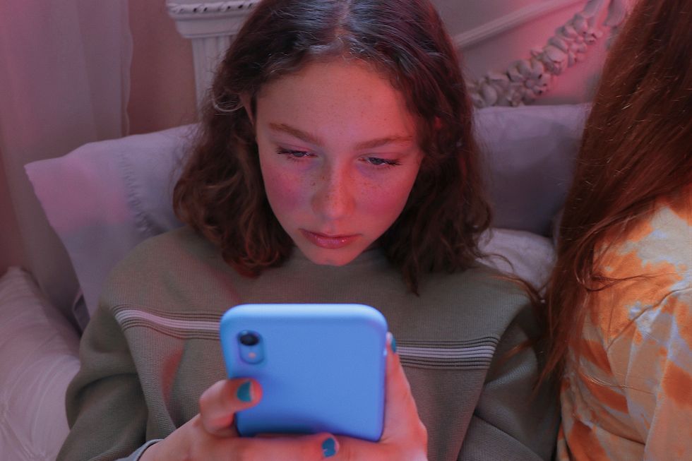 teenage girl using her cell phone