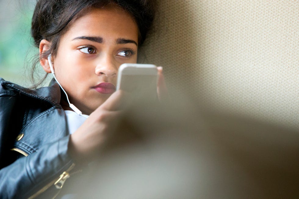 teenager on her mobile phone