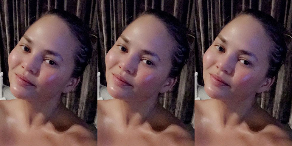 Chrissy Teigen glows as she shares candid topless snap using