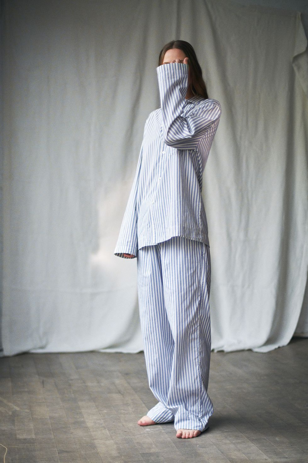 woman wearing striped pyjamas