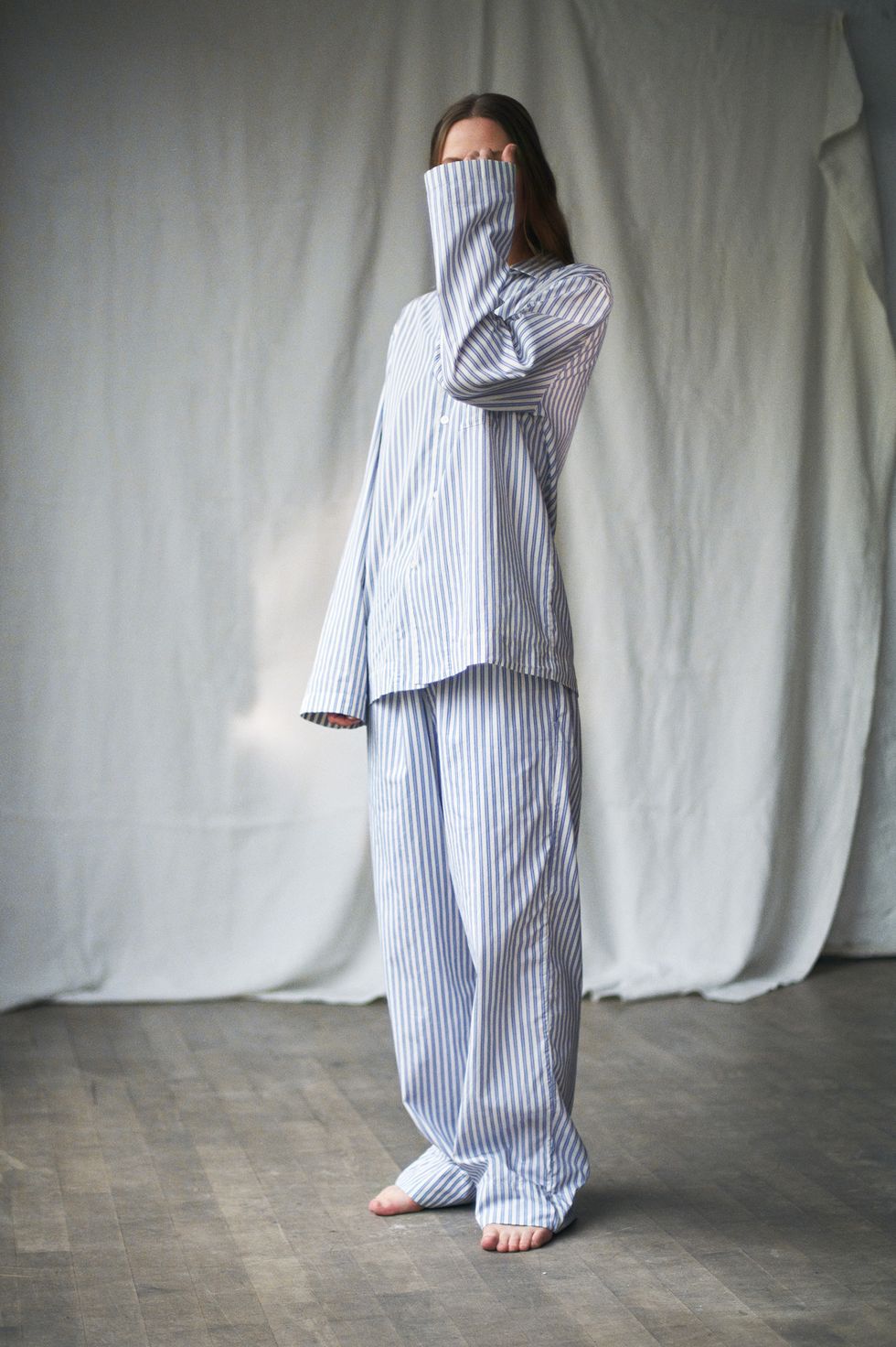 woman wearing striped pyjamas