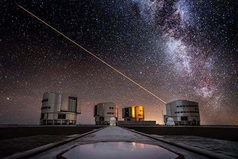 hn2kye laser beam from the ut4 telescope in the sky above the paranal eso observatory in chile with the milky way in the background