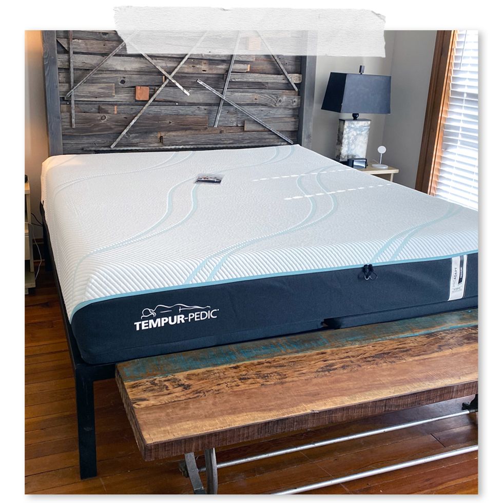 tempurpedic pro adapt mattress on bed with wooden headboard