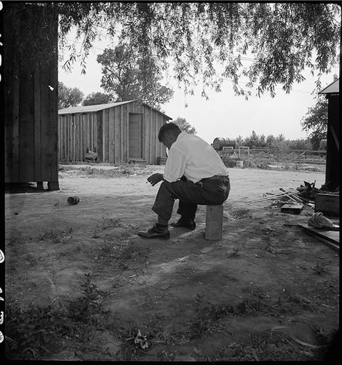 Tenant farmer of Japanese ancestry who has just completed settlement of their affairs and everything is packed ready for evacuation in Woodland, California.
