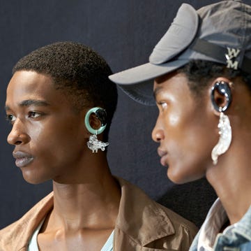 a man and woman wearing earrings