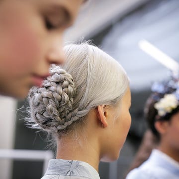 a man with a flower in his hair