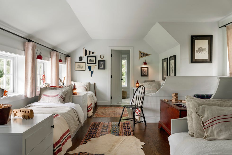 tennessee farm cabin bunk room with builtin beds topped with red striped blankets