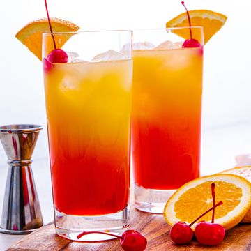 grenadine and orange juice layered tequila cocktail in a glass
